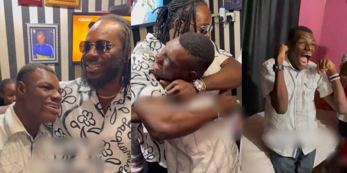 Adekunle Gold pays surprise visit to physically challenged fan, pledges N2m scholarship fund in heartwarming video (Watch)