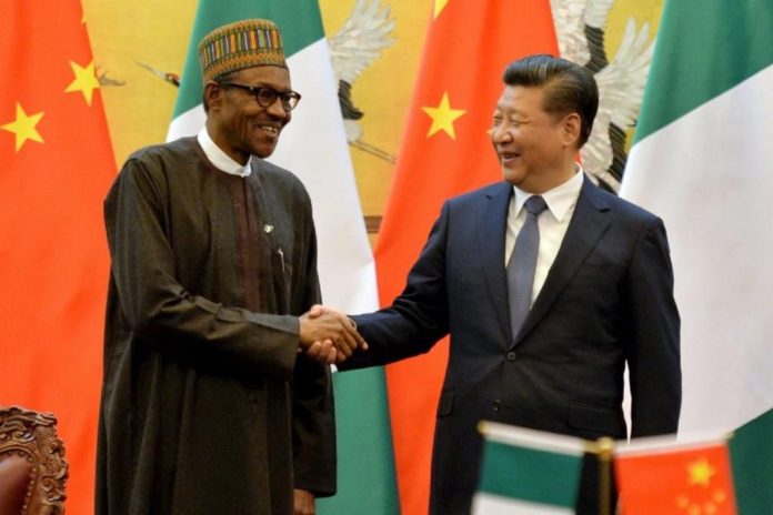 Nigeria President Buhari in handshake with Chinese president Xi Jinping