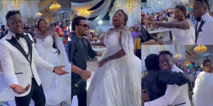 Couple shocked as singer, Olamide makes surprise appearance, performs at their wedding (Video)