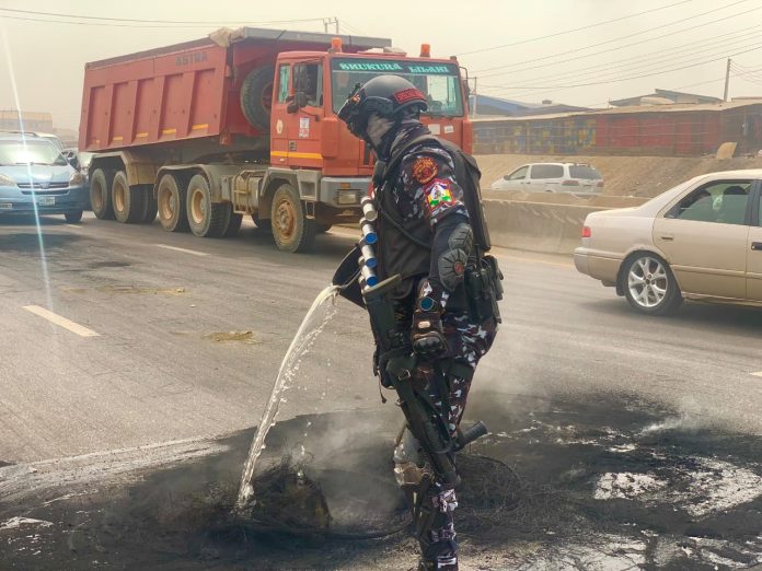 Lagos response team clears debris burnt by protesters