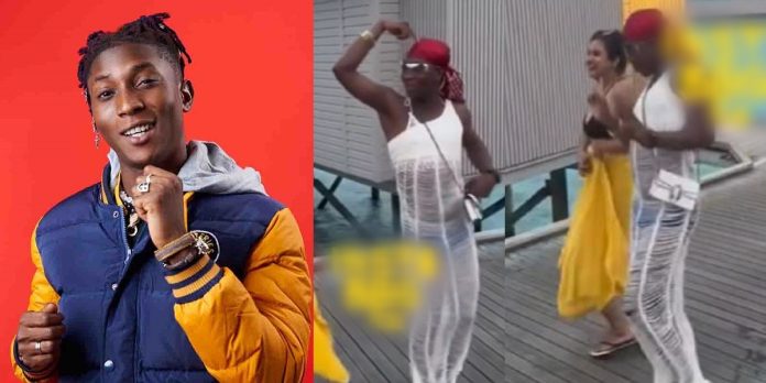 Singer Bella Shmurda causes a massive stir as he rocks a dress while on vacation in Maldives (Video)