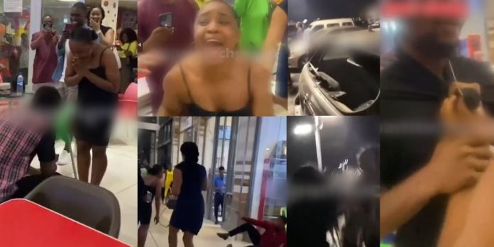 “Why will you embarrass me like this ?” – Lady loses her cool, smashes lover’s car windscreen after he played proposal prank on her in a mall (Video)