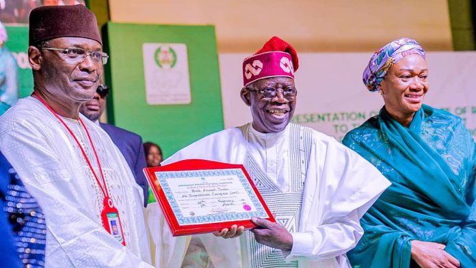 President-Elect Bola Tinubu receiving his Certificate of Return