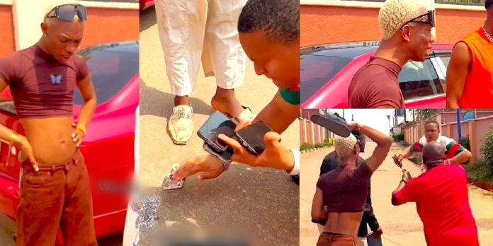 Crossdresser, James Brown creates a scene in Asaba after man damaged his phone (Video)