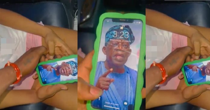 Man angrily takes back iPhone from his babe after seeing Tinubu as her wallpaper (Video)