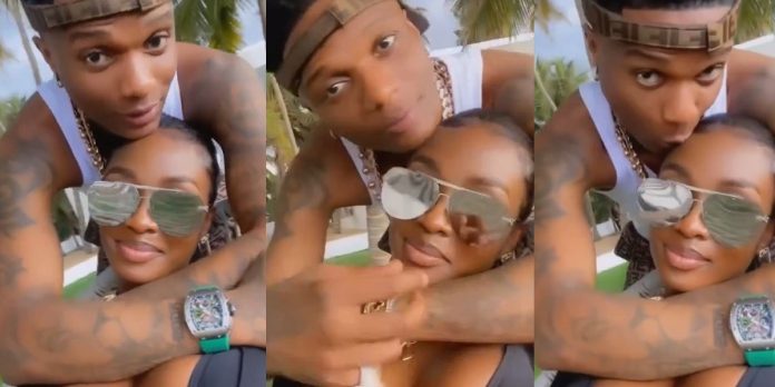 “A slap on Jada” – Netizens react to video of Wizkid all loved up with mystery lady, calling her girlfriend (Watch)