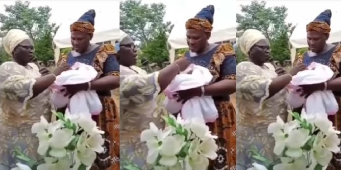 Outrage as woman prays for newborn baby to grow up to be part of those who will embezzle Nigeria’s money (Video)