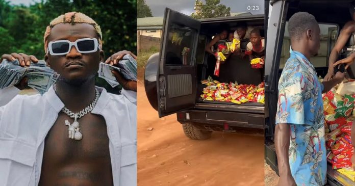 Portable uses his new G-Wagon to distribute foodstuff to needy children (video)