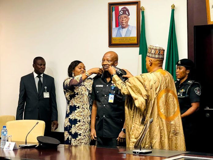 Kayode Egbetokun being decorated by the vice president, Kashim Shettima