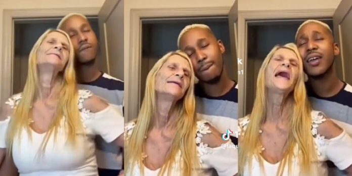 “All in the name of Canadian passport” – Reactions as young man shares loved-up moment with elderly foreign lover (Video)