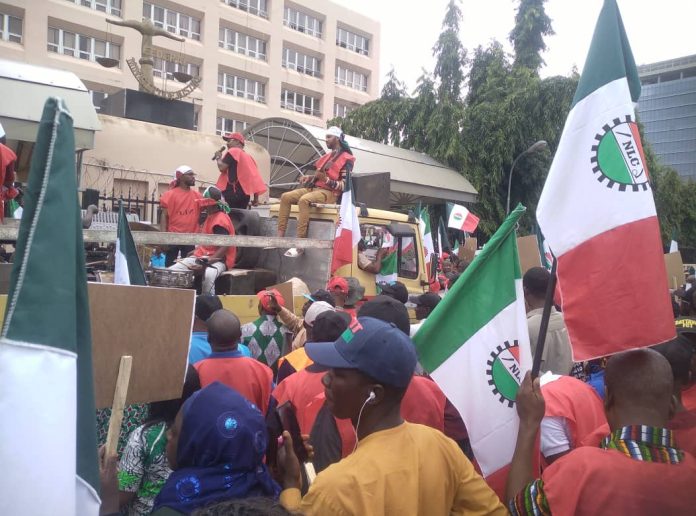NLC members occupy entrance of Federal Ministry of Justice in Abuja… on Wednesday. Olukayode Jaiyeola