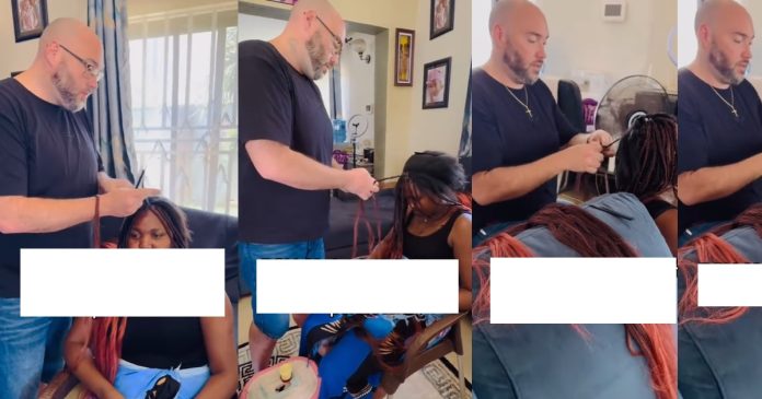 Heartwarming video of American man braiding his Ugandan wife's hair (WATCH)