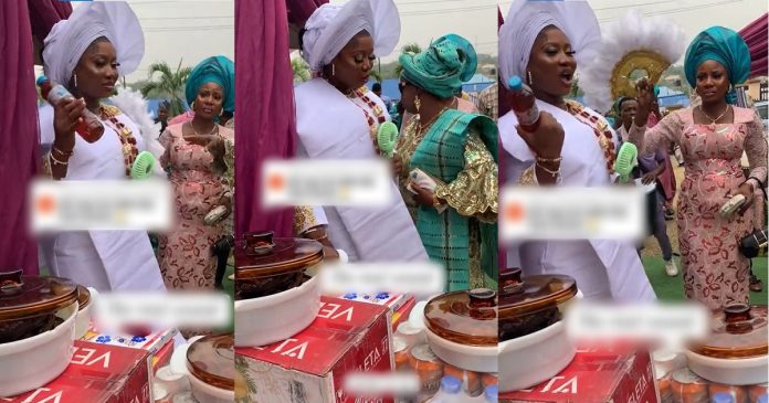 Nigerian mother angrily walks away after her daughter picked a bottle of honey instead of a Bible at her traditional wedding (video)