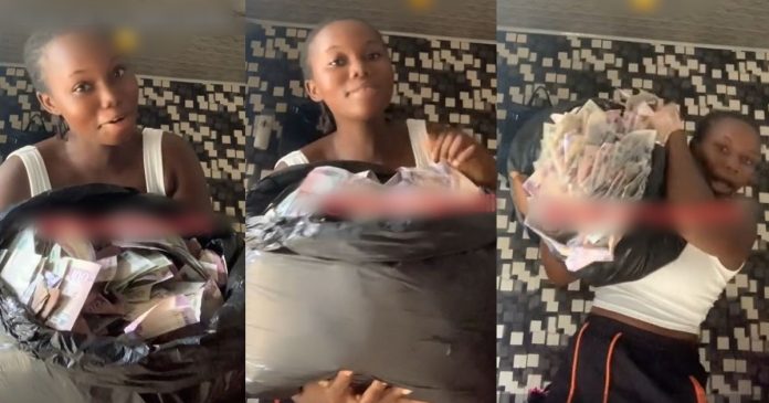 Netizens React As Lady Flaunts Pile Of Cash She Claimed To Have Picked At The Club (WATCH)