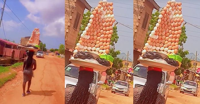 Ghanaian egg vendor amaze customers as she skillfully arranged eggs while hawking (Watch)