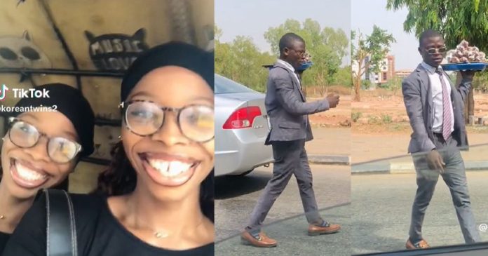 Nigerian Twins Capture Unique Moment They Sighted A Hawker Wearing Suit In Abuja (VIDEO)