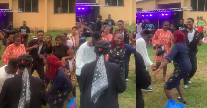 Jubilation erúpts as a female lecturer shows off dancing skills at her students' party (VIDEO)