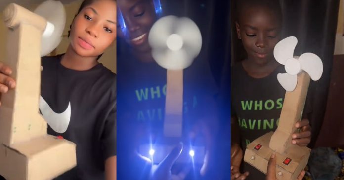 Lady shows off the 'carton fan' her brother fixed for her after their generator had a fault (WATCH)