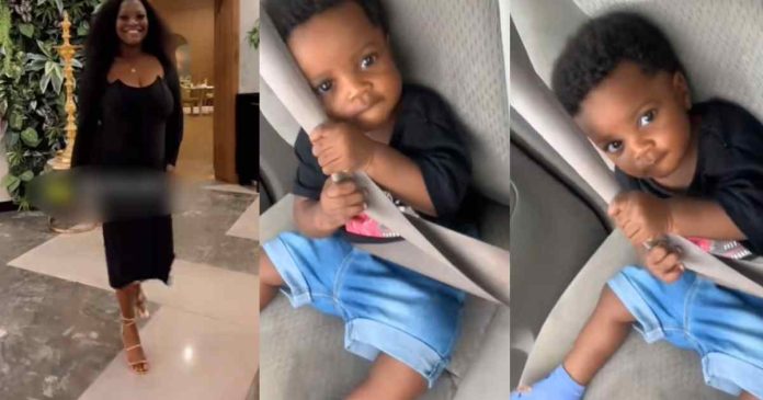 "He doesn't trust my driving skills" –  Woman says as her 8-month-old son gripped his seatbelt tightly while she drove (WATCH)