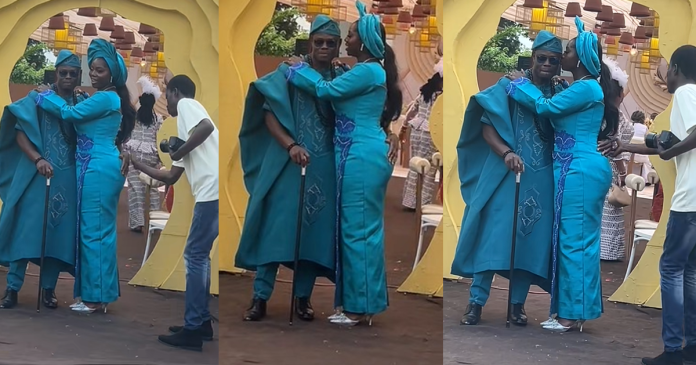 Hilarious moment a groom was taught how to pose with his bride by a photographer (WATCH)