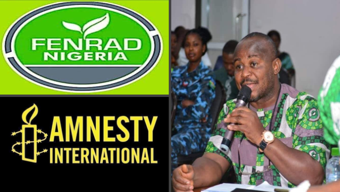 Comrade Nelson Nnanna Nwafor of FENRAD Nigeria speaking into a microphone during a civil society event, alongside logos of FENRAD Nigeria and Amnesty International.
